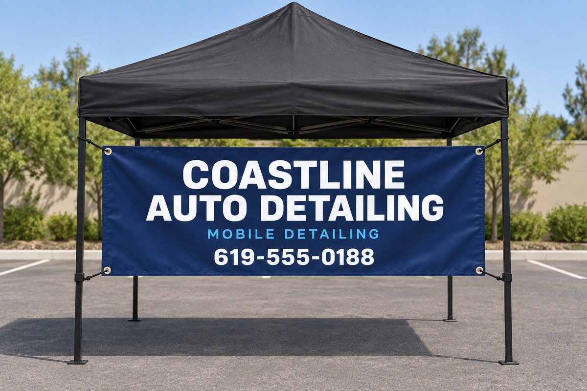 Custom vinyl banner displayed on a pop-up canopy tent